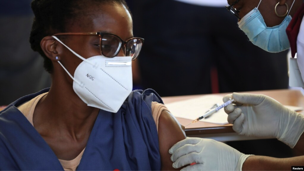 A health care worker receives the Johnson and Johnson coronavirus vaccination in Soweto, South Africa.