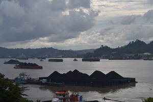 Coal barges in Samarinda, East Kalimantan, Indonesia. Credit...Adek Berry/Agence France-Presse — Getty Images