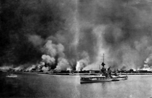 HMS Iron Duke with burning Smyrna behind it. Courtesy of Wikimedia Commons