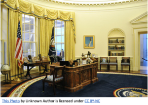 The Oval Office, 1990s, Resolute Desk in foreground.